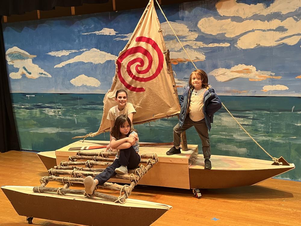 Andrew DiDonato's three children Rosalie (in white t-shirt), Liliana (sitting) and Massimo (standing) on the boat he built for Rosalie's school play, Moana Junior.