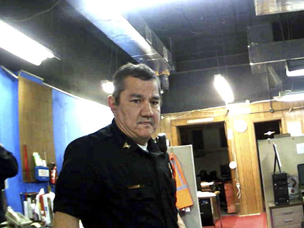This image from Marion, Kan., Police Department body camera video provided by the McDonald Tinker law firm shows former Marion Police Chief Gideon Cody during his department's raid of the Marion County Record newspaper on Aug. 11, 2023, in Marion, Kan.