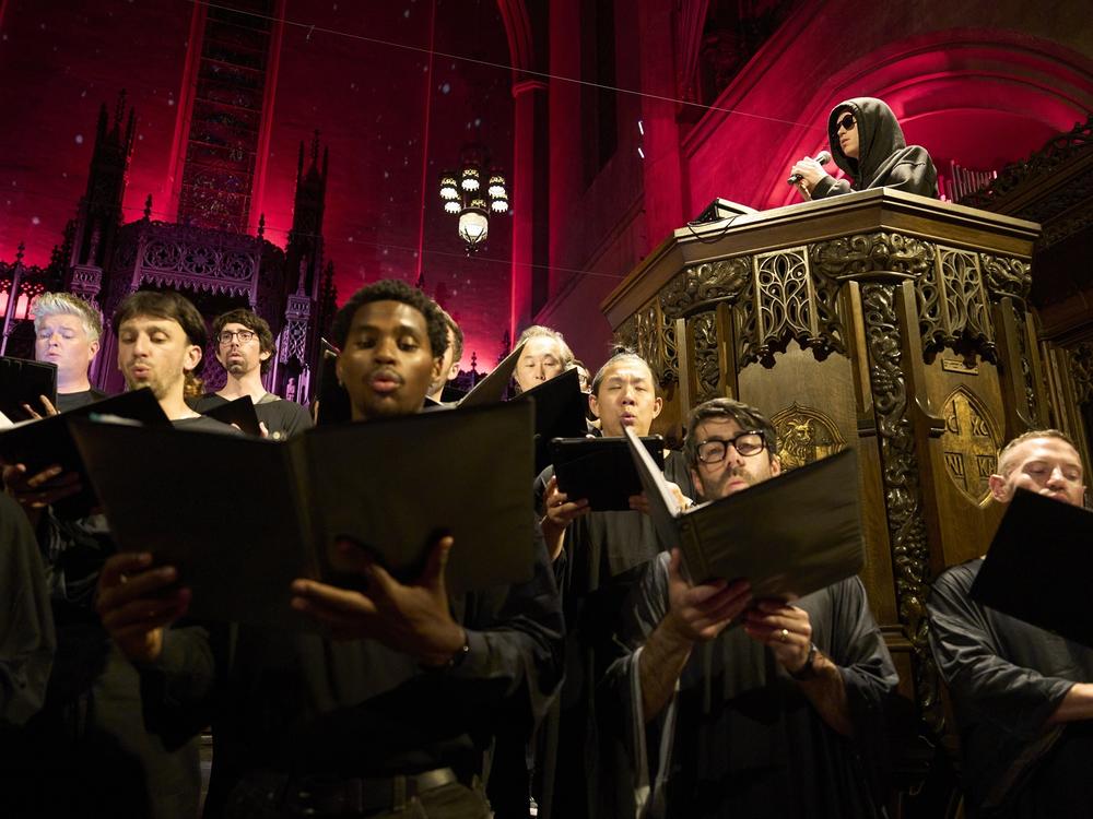 Louis Cole commands the pulpit as singers join in the performance at the First Congregational Church of Los Angeles.