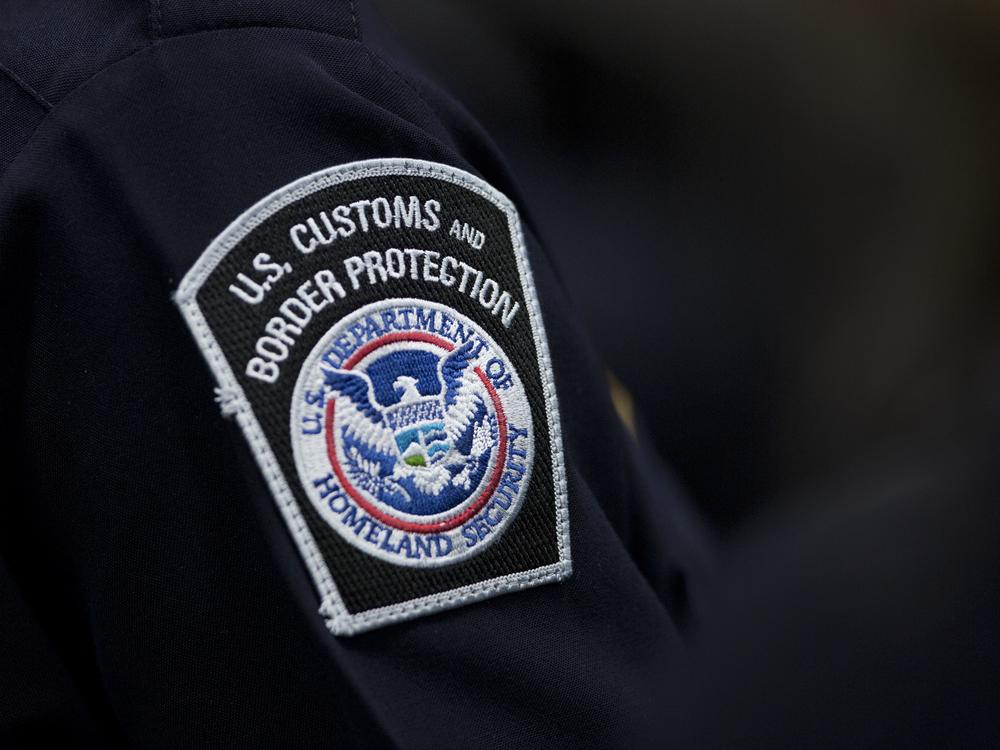 A customs agent wears a patch for the U.S. Customs and Border Protection agency on Oct. 27, 2017, at John F. Kennedy International Airport in New York.