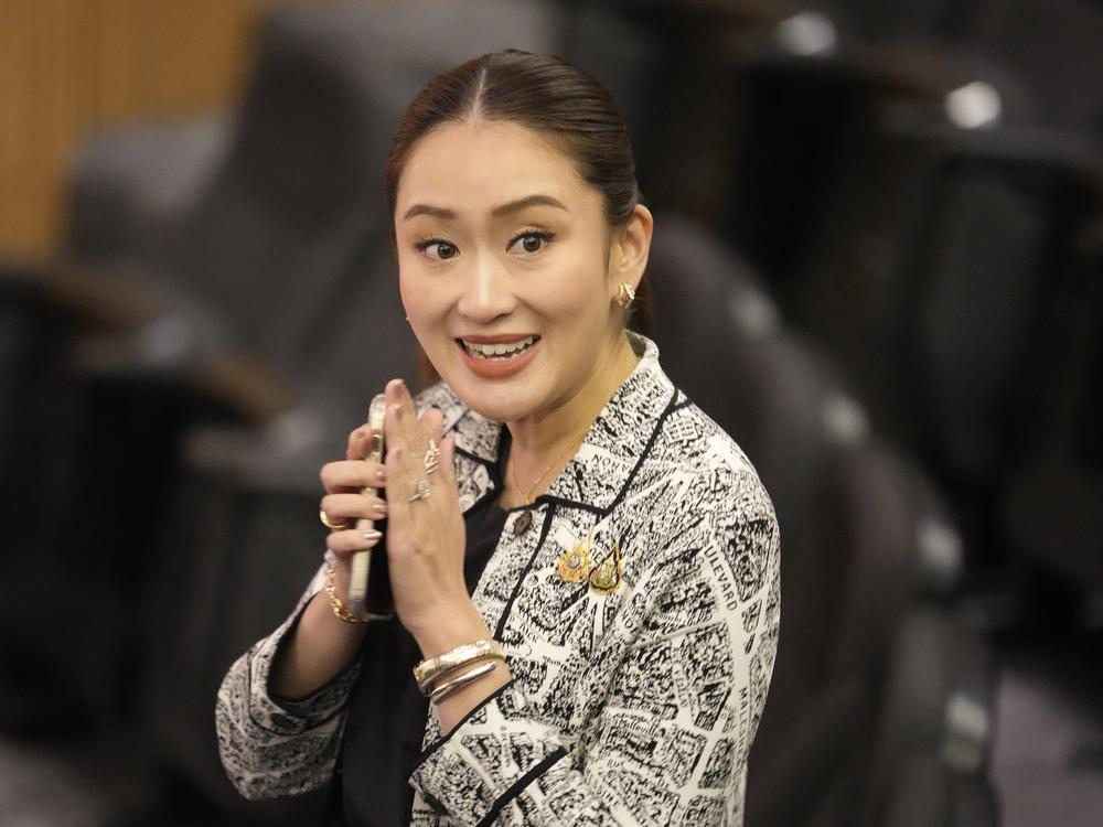 Paetongtarn Shinawatra, leader of Pheu Thai Party and daughter of Thailand's former Prime Minister Thaksin Shinawatra, smiles before a news conference in Bangkok on Thursday.