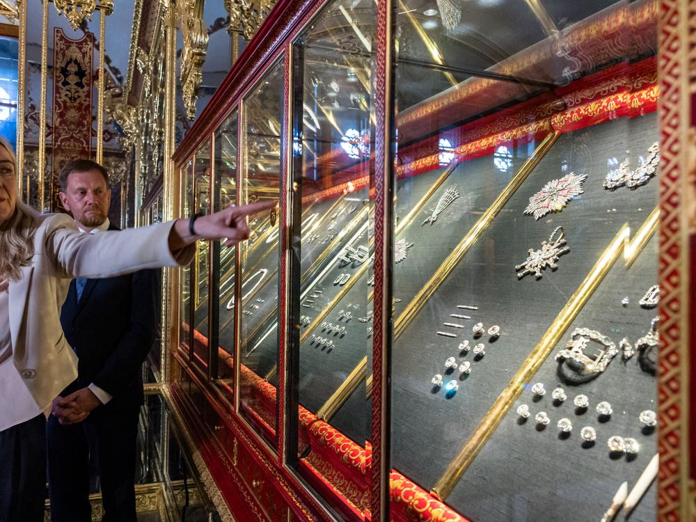 Marion Ackermann, director general of the Dresden State Art Collections, points to a display case with some of the recovered jewelry during a press event at the Green Vault in Dresden, Germany, on Tuesday.