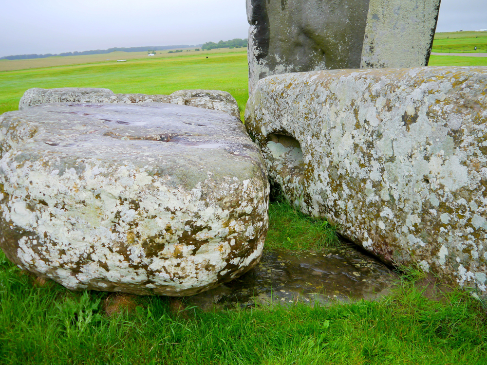 The Altar Stone, seen here underneath two bigger Sarsen stones.