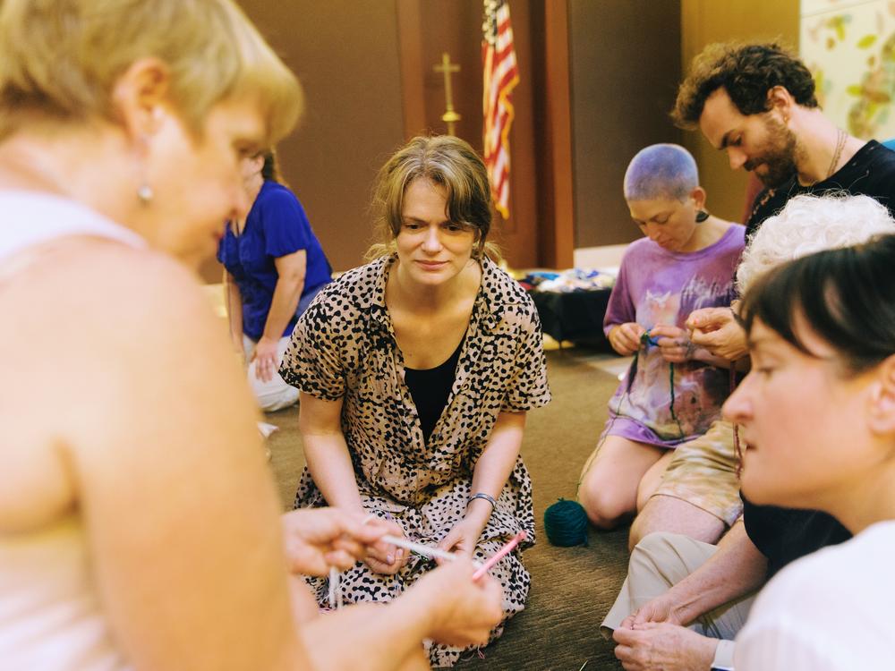 Virginia McLure learns how to crochet from Mary Pat Klein. 