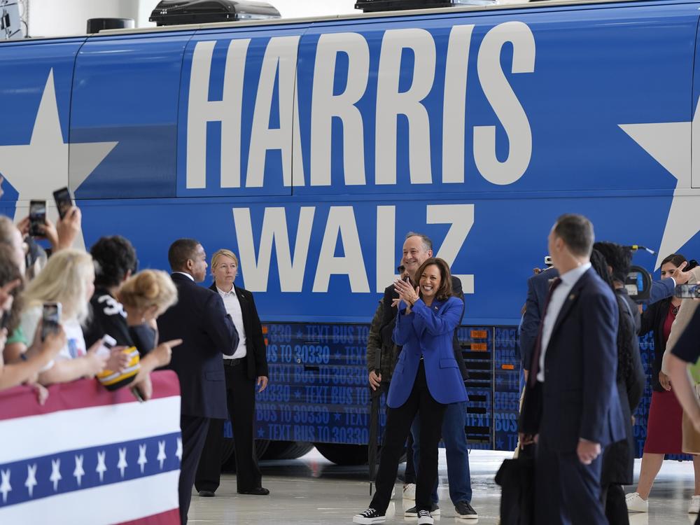 Democratic presidential nominee Vice President Kamala Harris and her husband, Doug Emhoff, greet supporters at Pittsburgh International Airport in Pittsburgh on Sunday. 