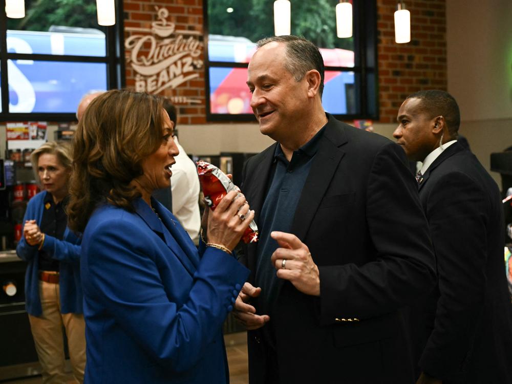 Vice President Harris gets some Doritos with her husband second gentleman Doug Emhoff at a Sheetz gas station in Coraopolis, Penn., during a bus tour on Sunday.