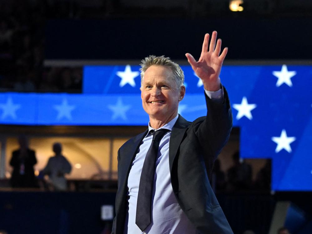 Golden State Warriors and Team USA head coach Steve Kerr walks on stage to speak on the first day of the Democratic National Convention in Chicago, Illinois, on August 19, 2024.
