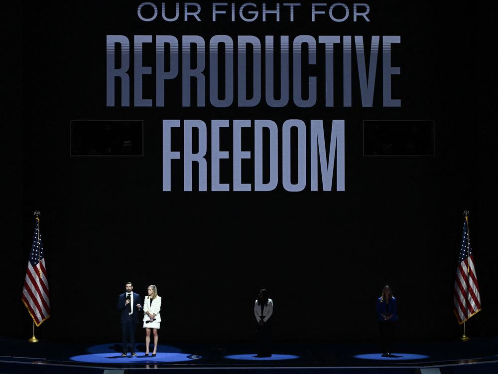 Amanda Zurawksi and Josh Zurawski (L) speak about reproductive rights on the first day of the Democratic National Convention in Chicago, Illinois, on August 19, 2024.