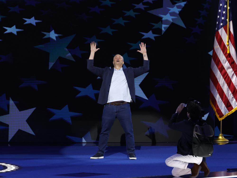 Second gentleman Doug Emhoff goofs around during a sound check at the start of the Democratic National Convention at Chicago's United Center on Aug. 19, 2024.