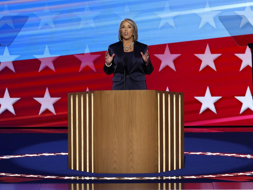 New Mexico Gov. Michelle Lujan Grisham speaks on stage during the second day of the DNC. 