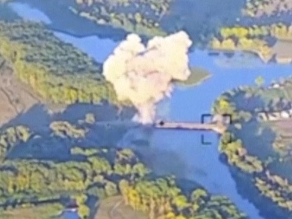 Smoke billows above a bridge on the Seym River in Russia's western region of Kursk. Ukraine's military released the footage on Sunday, saying this was the second bridge on the river it has destroyed in recent days. The bridge could have been a route for Russia to send in reinforcements to the area, where Ukrainian troops invaded Russia on Aug. 6.