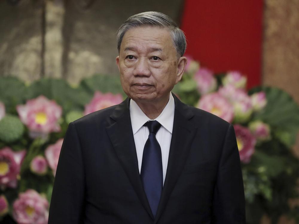 Vietnamese President To Lam is shown waiting for the arrival of Japanese former Prime Minister Yoshihide Suga at the Presidential Palace in Hanoi, Vietnam, on July 25, 2024.