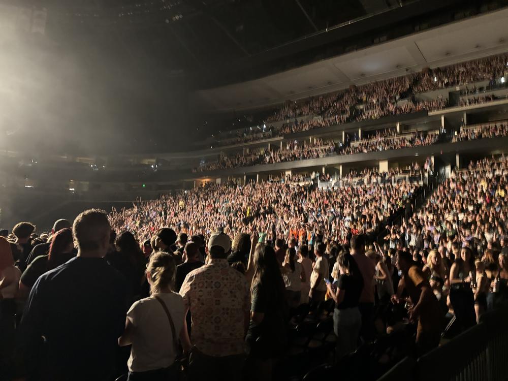  AJR fans at Denver's Ball Arena perform the wave on June 20, 2024.