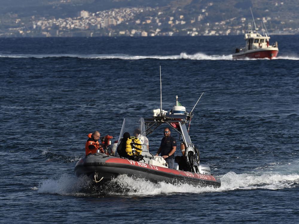 Emergency services at the scene of the search for a missing boat, in Porticello, southern Italy, on Tuesday.