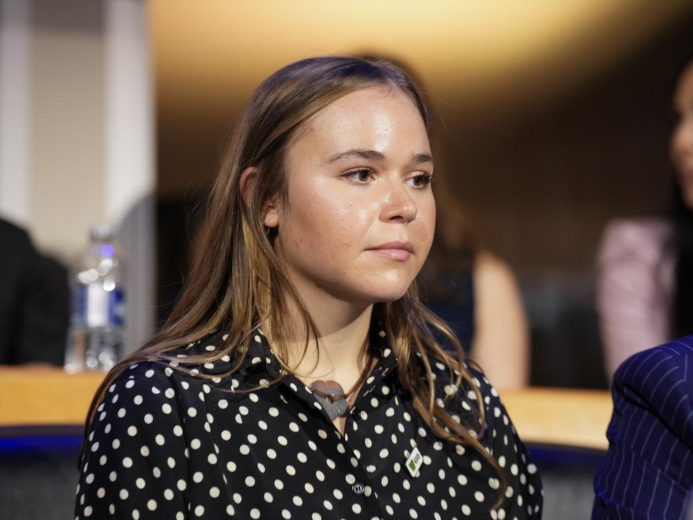 Gov. Tim Walz's daughter, Hope Walz, watches the proceedings during the first day of the Democratic National Convention on Monday in Chicago. 