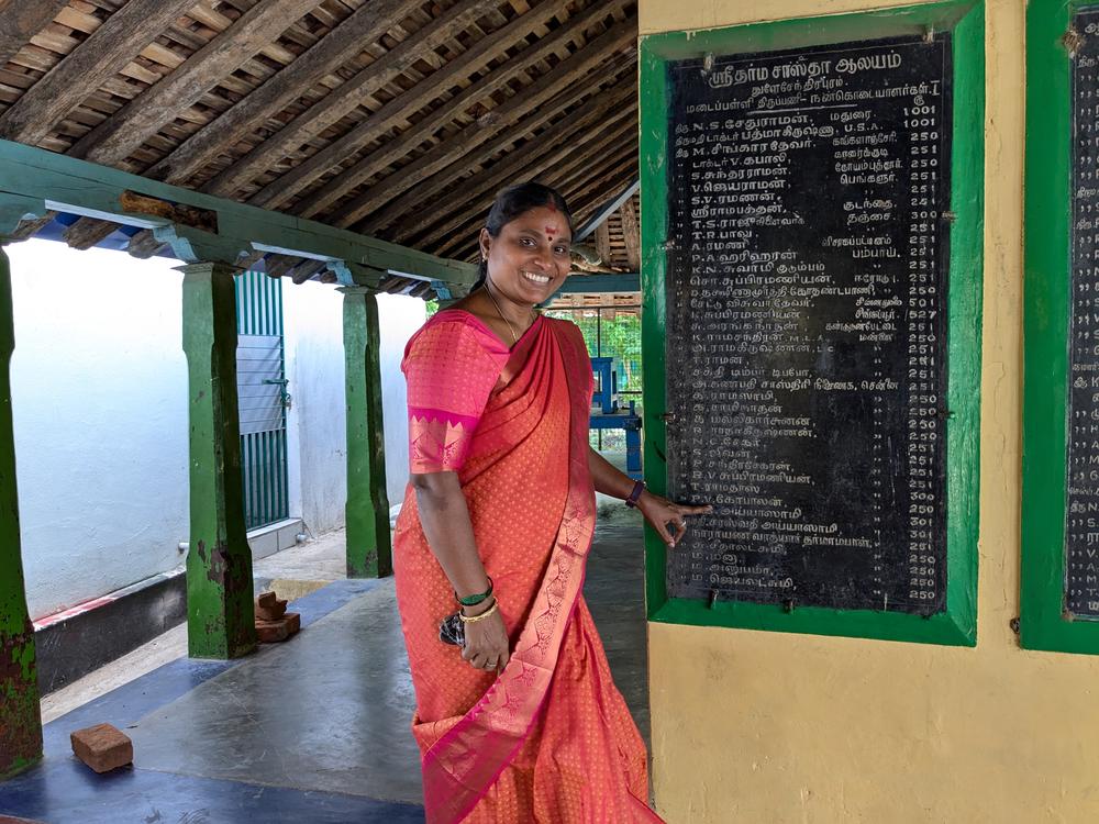 Arulmozhi Sudhakar points to the name of P.V. Gopalan, Kamala Harris' maternal grandfather, inscribed on a wall of the local Hindu temple. Harris' own name is also inscribed on the temple wall. The temple's trustee says an aunt of Harris who lives in India donated 5,000 rupees (roughly $60) in 2014 to the temple in her niece’s name.