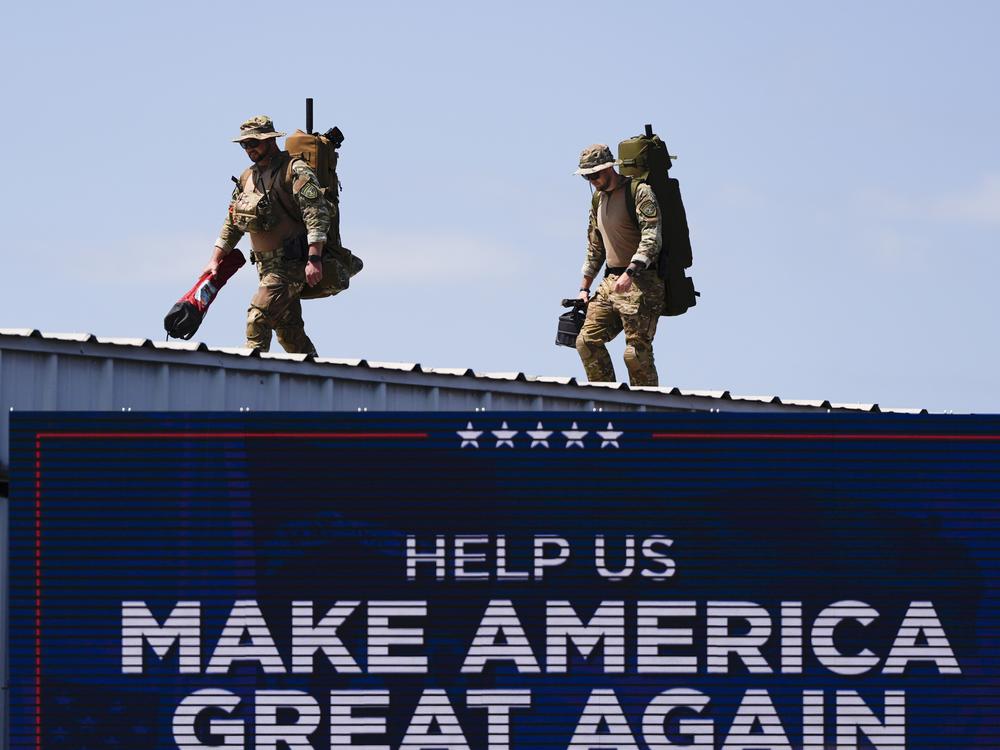 Security gets in position prior to Republican presidential nominee former President Donald Trump speaks at a rally Wednesday in Asheboro, N.C.