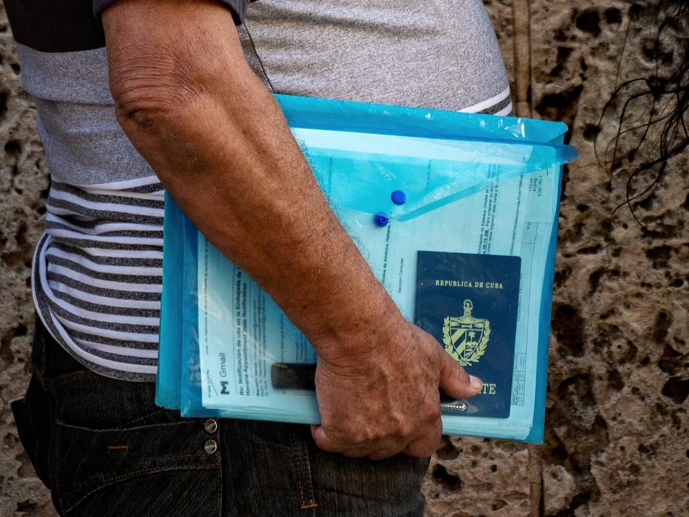 A Cuban with his documents queues at the U.S. embassy in Havana on May 3, 2022. Long times to get a visa plague the U.S. immigration system.