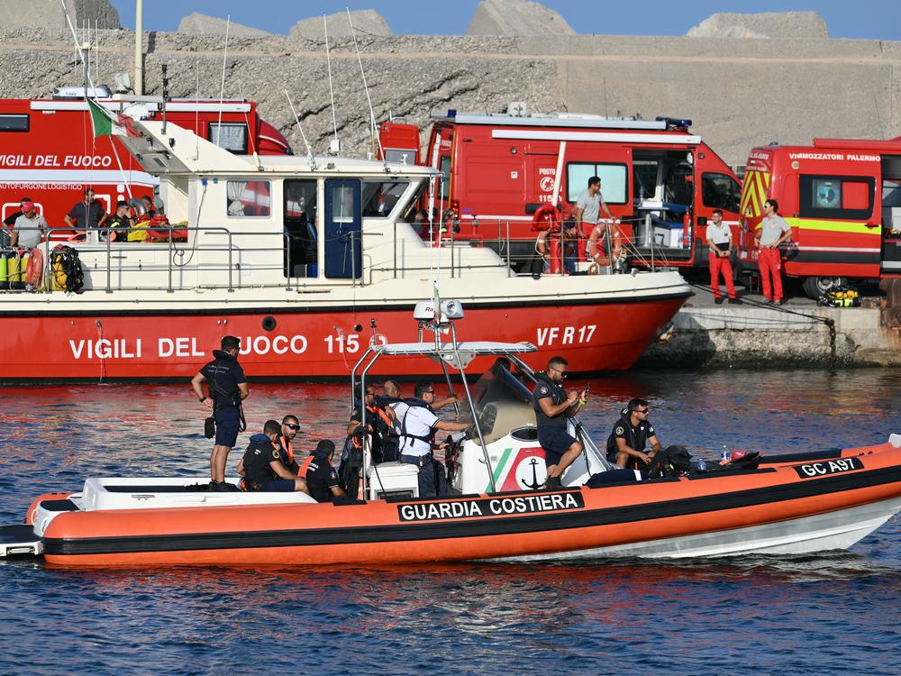 A rescue boat of the Italian Coast Guard operates in Porticello near Palermo, on Tuesday, a day after the British-flagged luxury yacht Bayesian sank. Specialist divers launched a fresh search for six people, including U.K. tech tycoon Mike Lynch.