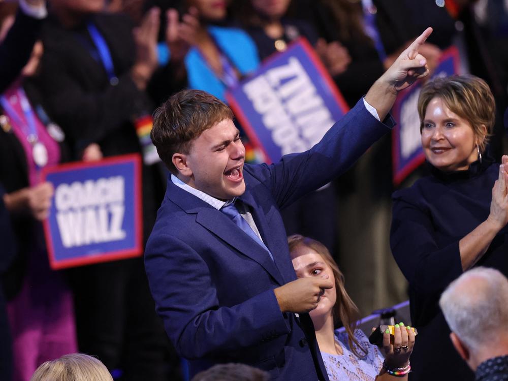 Gus Walz cheers as his father, Minnesota Gov. Tim Walz, gave a shoutout to his family while accepting the Democratic vice presidential nomination on the third day of the Democratic National Convention in Chicago.
