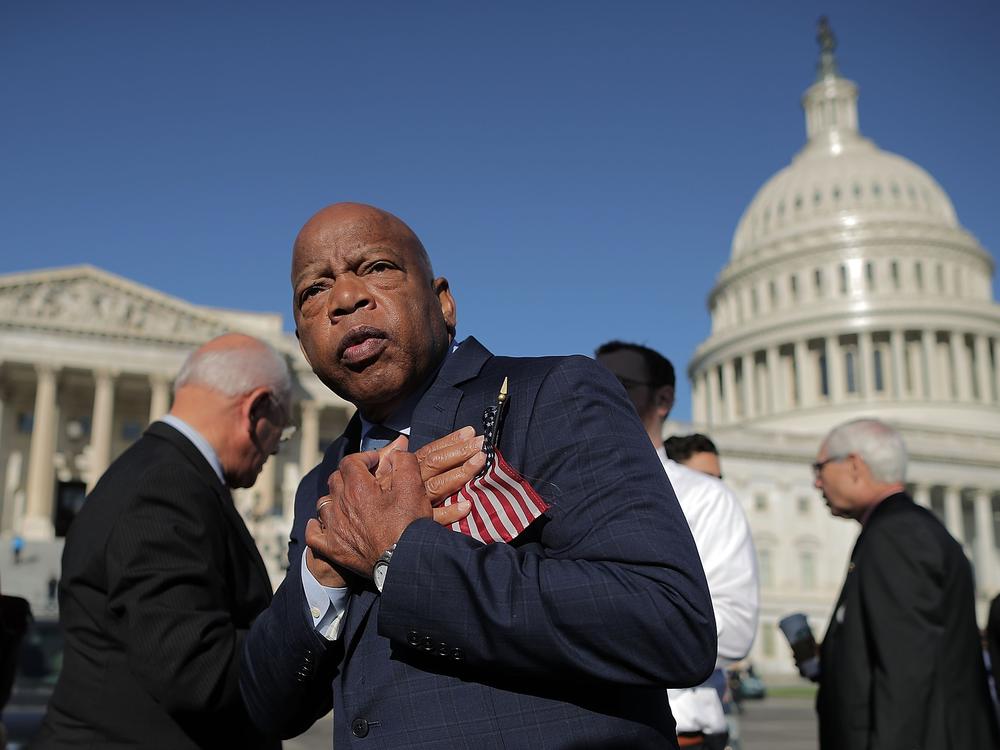 Rep. John Lewis thanks anti-gun violence supporters following a rally outside the U.S. Capitol on Oct. 4, 2017.