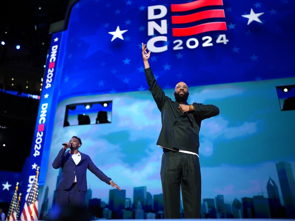 Rapper Common (R) and musician Jonathan McReynolds perform during the second day of the Democratic National Convention on August 20, 2024 in Chicago, Illinois.