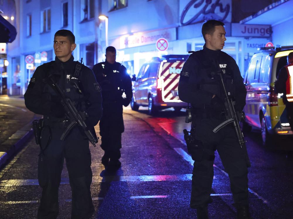 Police and ambulances near the scene where people were killed and injured in an attack at a festival in Solingen, western Germany, the German dpa news agency reported, Friday, Aug. 23, 2024.