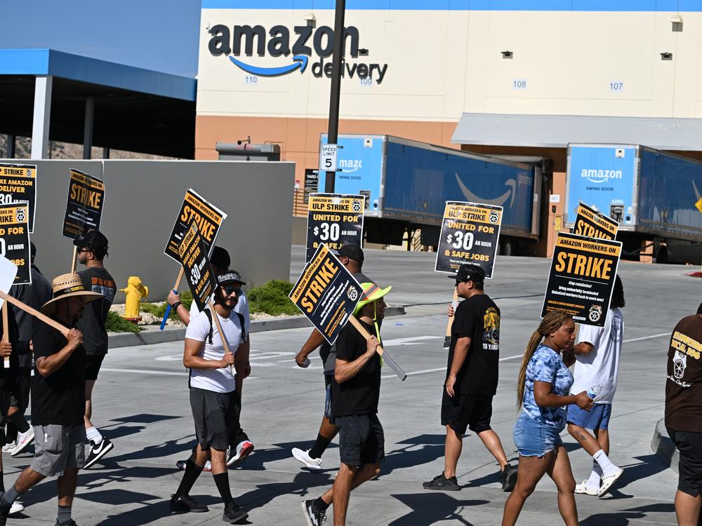 Amazon delivery drivers and dispatchers picket the company's Palmdale, Calif., warehouse and delivery center on July 25, 2023. 