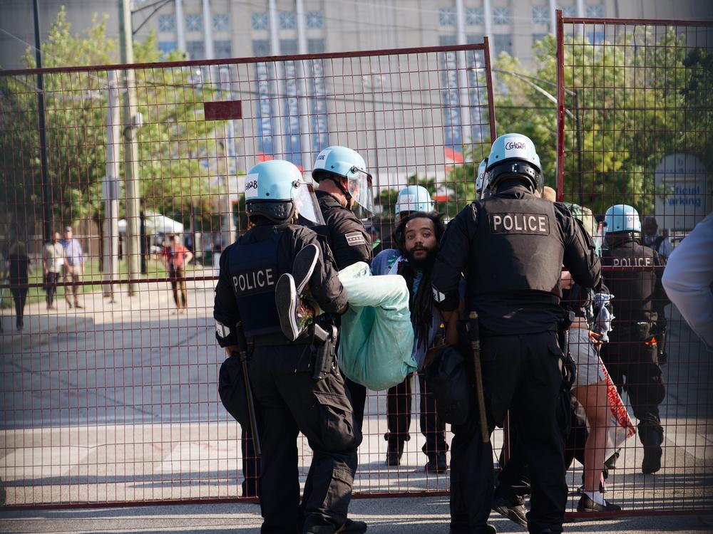 At least four protestors were arrested after breaking through the barricade. 