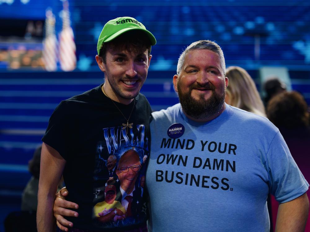 Adam Peters (left) and C.J. Petersen, both delegates from Iowa, wore t-shirts in homage to Minnesota Gov. Tim Walz leading up to his speech on the third night of the DNC. 