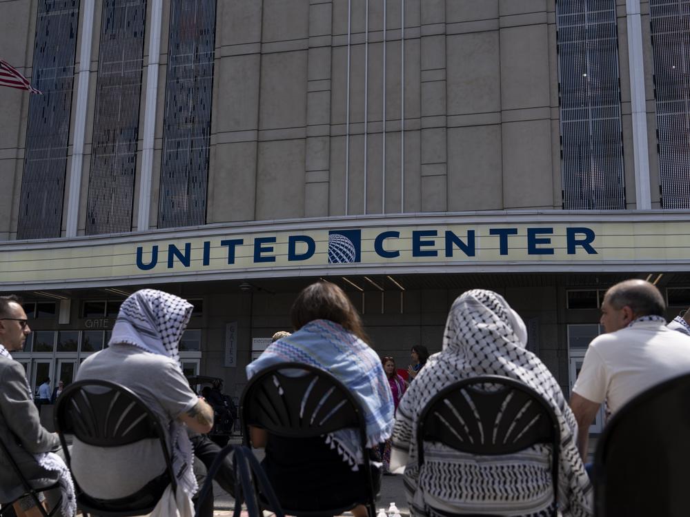 Leaders of the Uncommitted Movement participate in a sit-in outside the United Center ahead of the last day of the DNC.