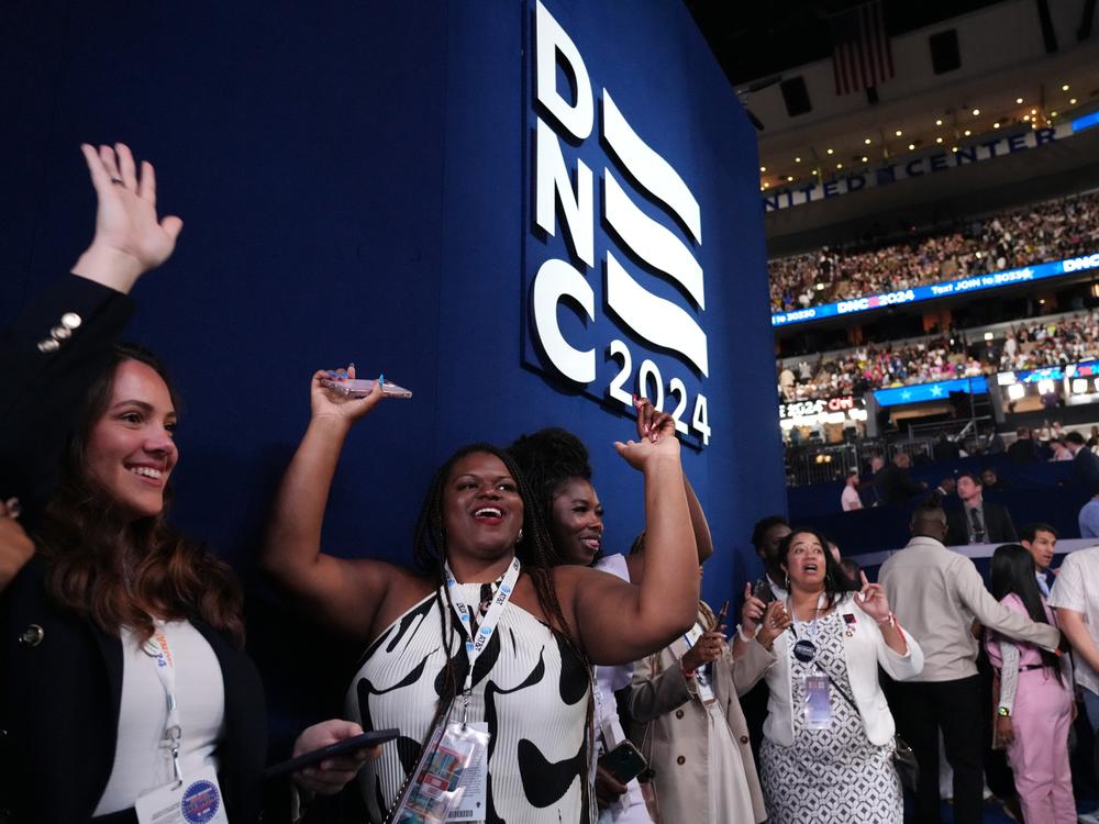 Delgates dance on the floor of the United Center on the final day of the DNC.