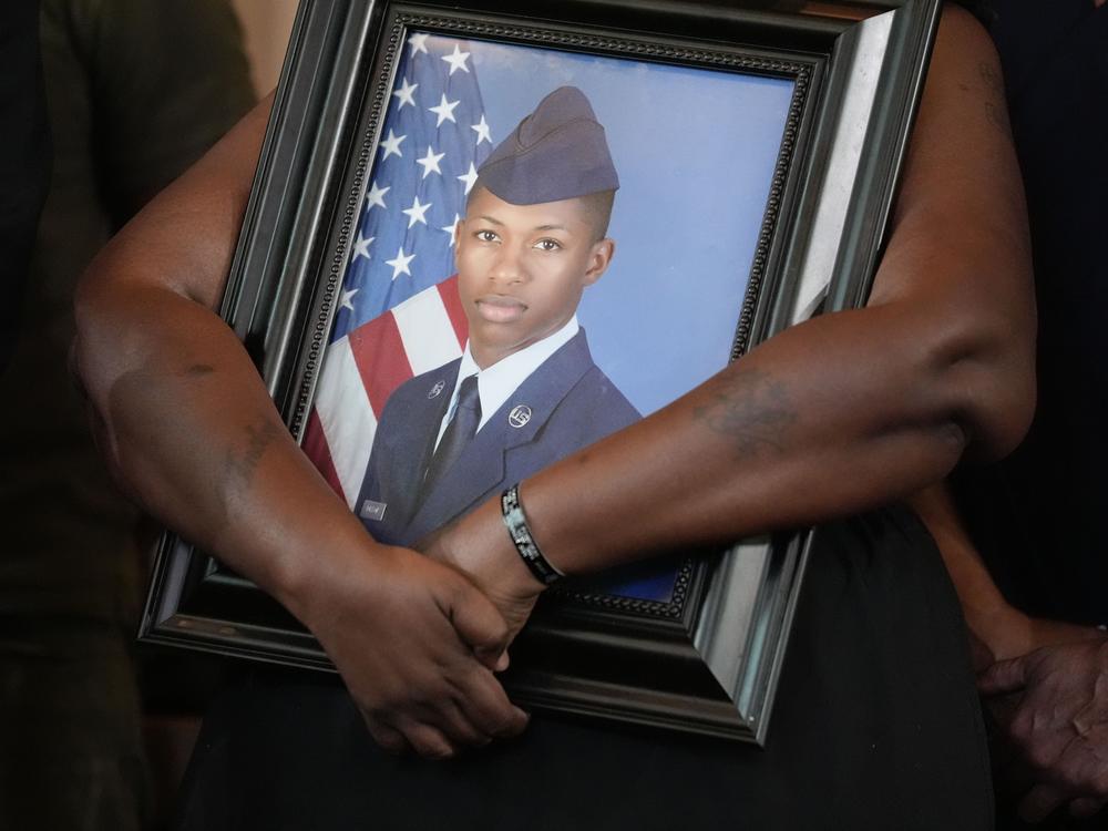 Chantemekki Fortson, mother of slain Roger Fortson, a U.S. Air Force senior airman, holds a photo of her son during a news conference with attorney Ben Crump on June 3, 2024, in Atlanta.