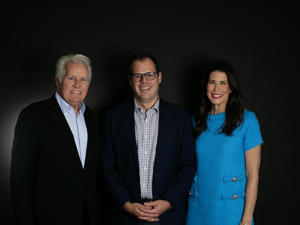 <em>All Things Considered</em> host Scott Detrow (center) with Martin Sheen and Melissa Fitzgerald.