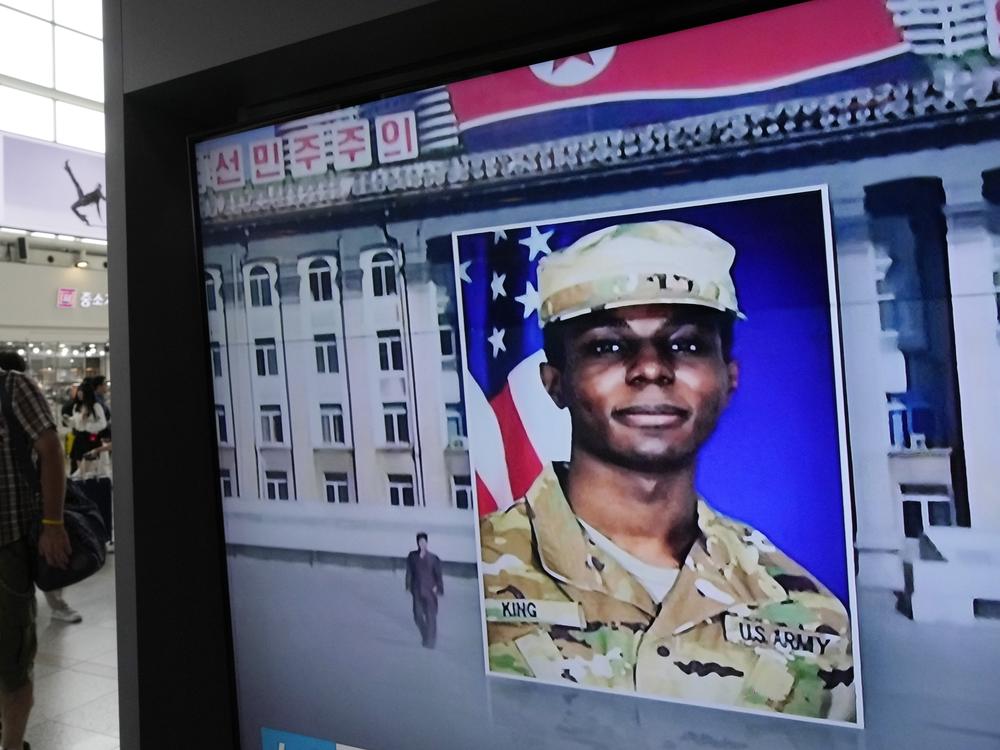 A television screen shows a file image of Pvt. Travis King during a news program at the Seoul Railway Station in Seoul, South Korea, on Aug. 16, 2023.