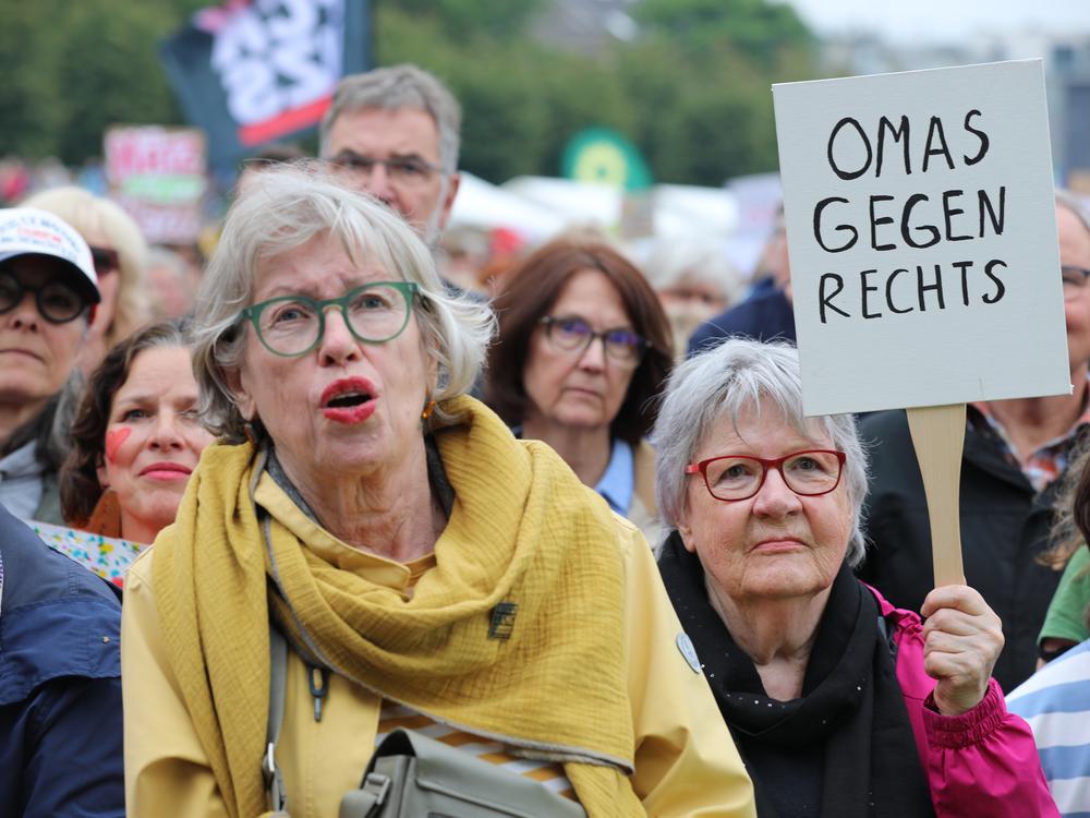 Demonstrators with signs reading 