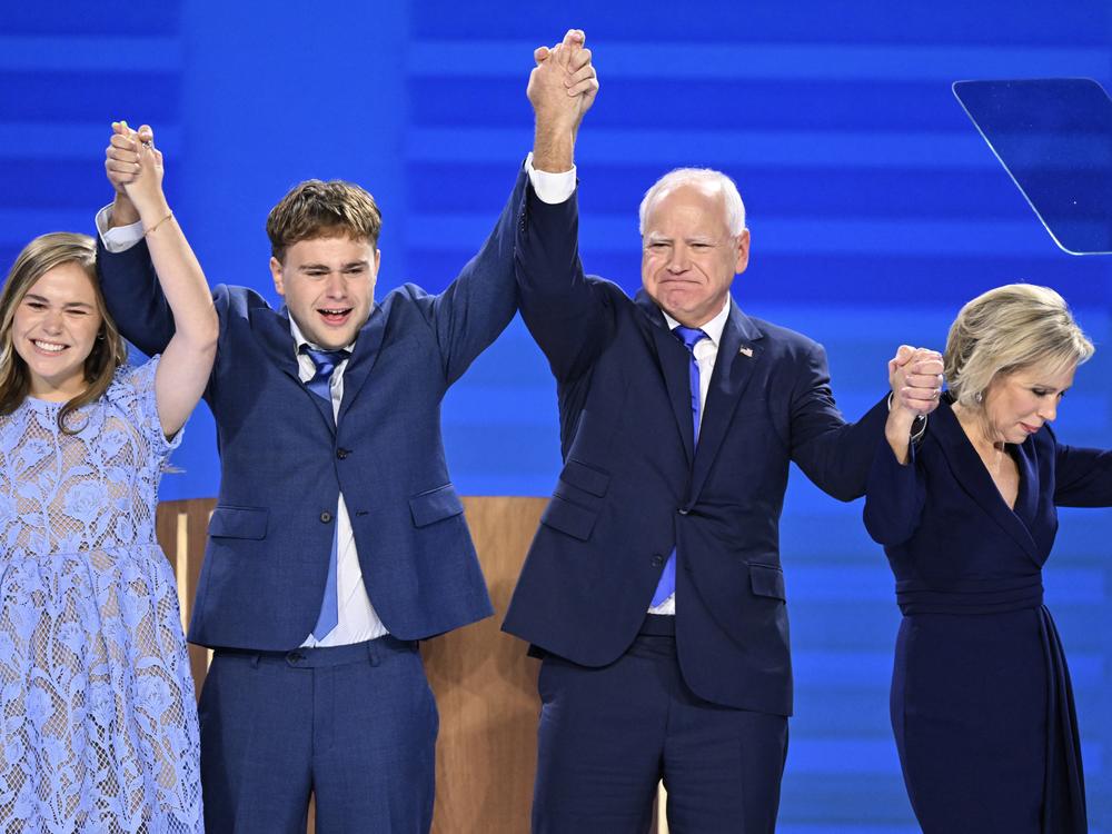 Walz stands on stage with his daughter Hope (left), son Gus (second from left) and wife Gwen (right) after he spoke at the DNC last week. 