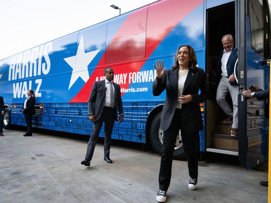 Harris and Walz step off their campaign bus in Savannah, Ga., on Wednesday, Day 1 of their tour in the state.