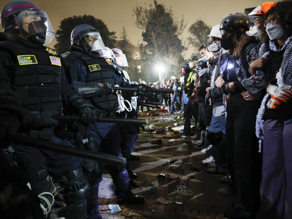 Police and pro-Palestinian students face off at the University of California, Los Angeles in May.