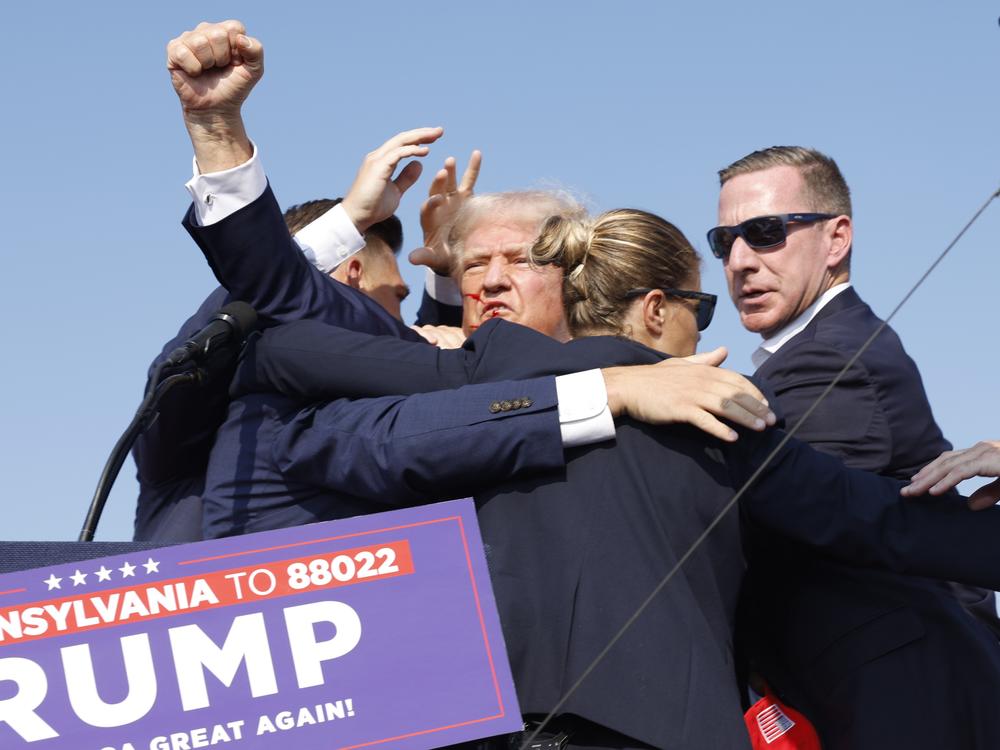 Former President Donald Trump is rushed offstage during a rally on July 13, 2024 in Butler, Pa., after an attempted assassination.