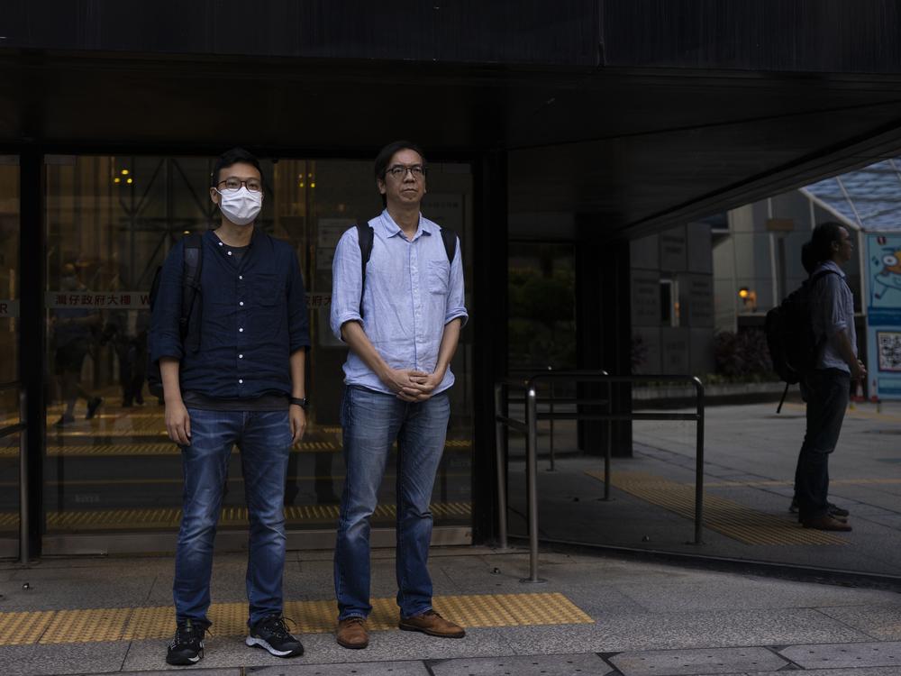 Former chief editor Chung Pui-kuen, right, and former acting editor Patrick Lam, left, of the now-defunct independent media outlet Stand News leave the court on the last day of the publication's sedition trial closing statements in Hong Kong on June 28, 2023.