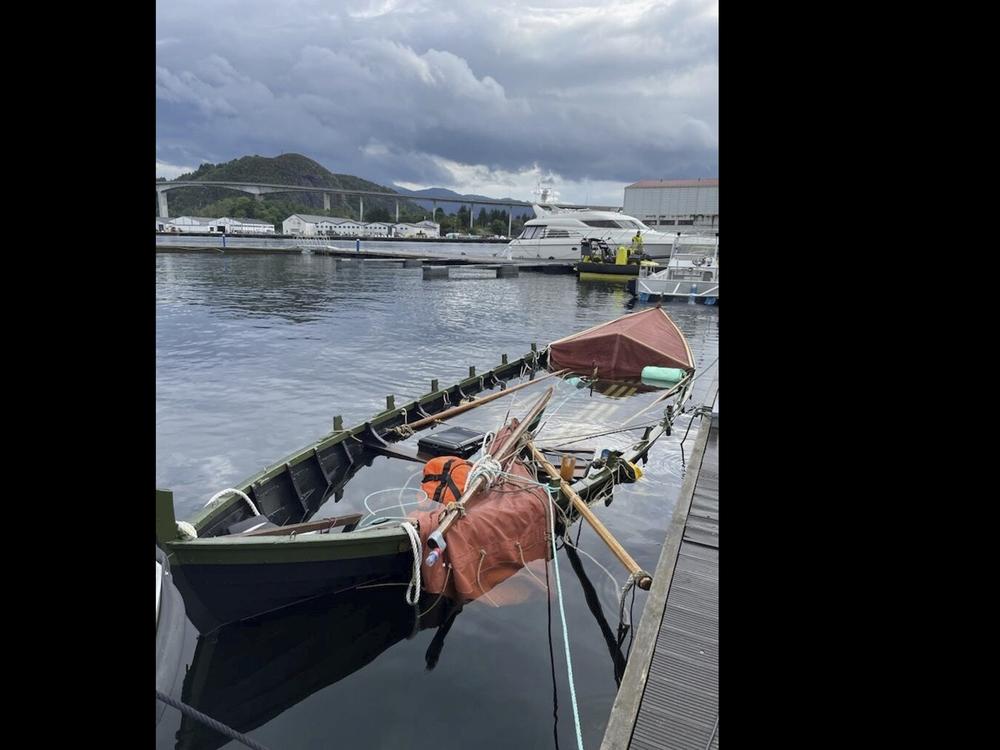 This photo released by the Norwegian Police shows the Viking ship replica, called Naddodd, moored at the quay in Måløy, Norway, on Wednesday, after it capsized earlier this week off Norway's coast.