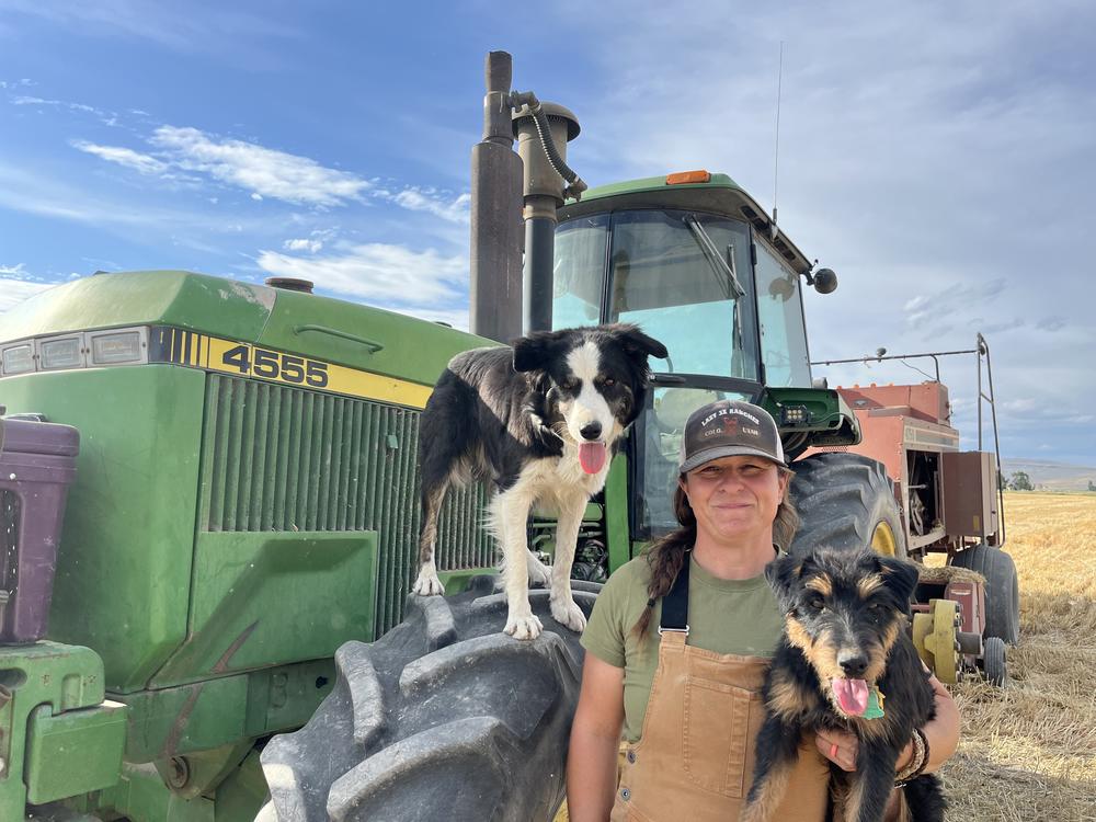 Rancher and volunteer wildland firefighter Kimberly Kerns takes a break from bailing straw near Baker City, Ore. 