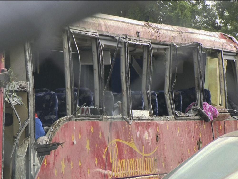 A damaged bus is shown after several people were killed and dozens injured after the commercial bus overturned on Interstate 20 early Saturday in Warren County, Miss., according to the Mississippi Highway Patrol. 