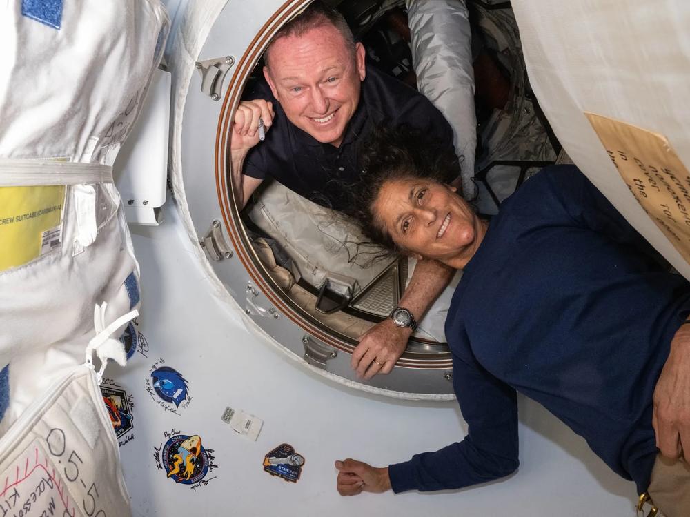 Butch Wilmore and Suni Williams inside the vestibule between the forward port on the International Space Station’s Harmony module and the Starliner spacecraft