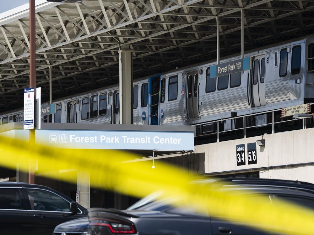 Yellow tape blocks off the parking lot of the Forest Park Blue Line train station in Forest Park, Ill., after four people were fatally shot on the train early Monday, Sept. 2, 2024. 