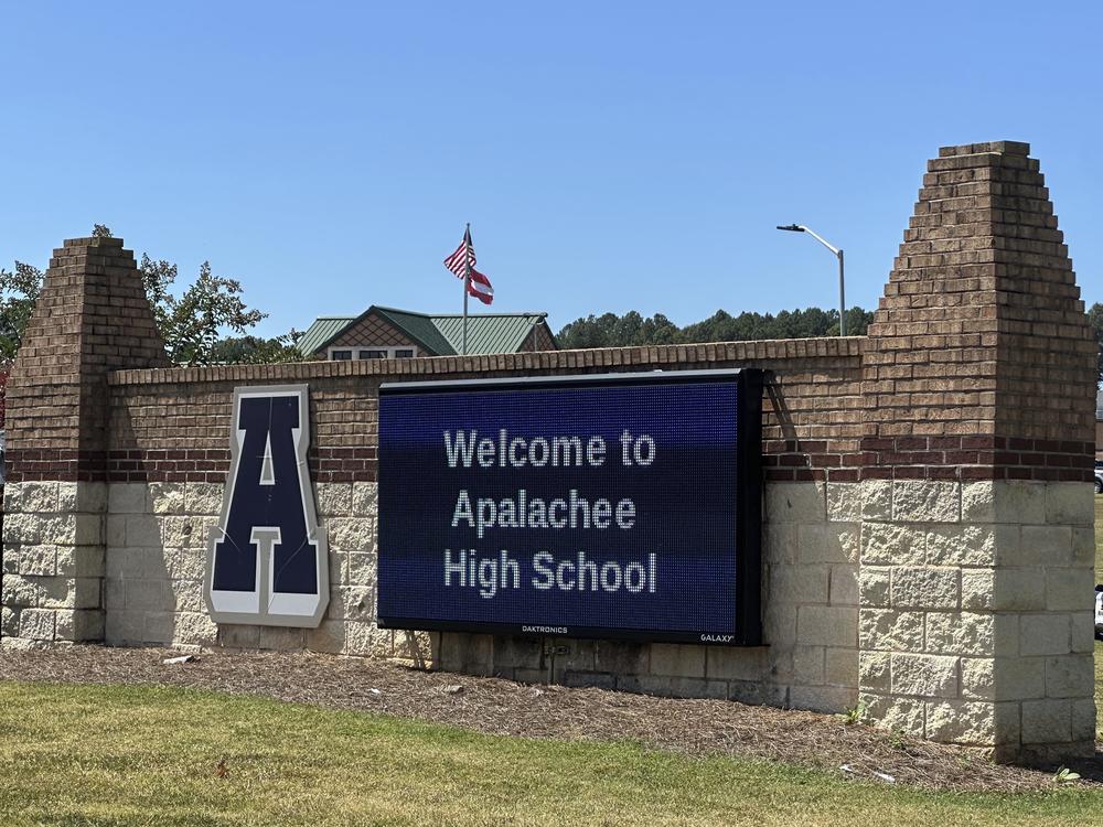 Students were evacuated to the football stadium after the school campus was placed on lockdown at Apalachee High School in Winder, Ga., on Wednesday.