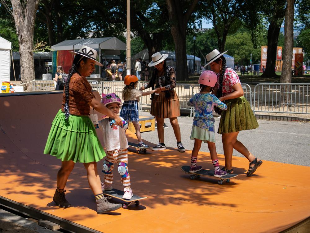 Bolivian skateboarders instruct kids in the art of skateboarding at the 2024 Smithsonian Folklife Festival. They tell youngsters that the skateboarding philosophy is 