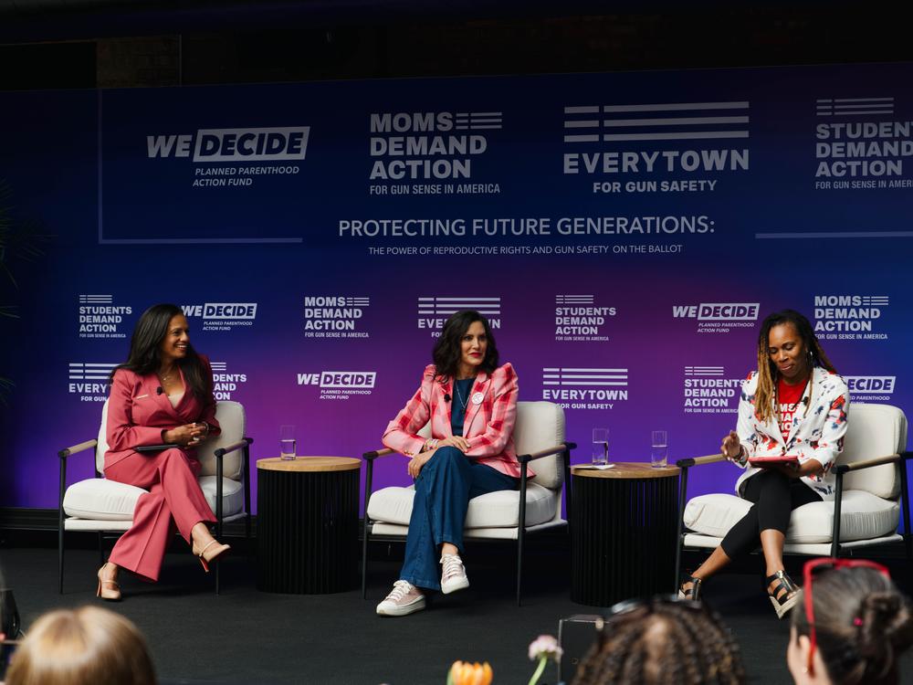 Michigan Governor Gretchen Whitmer (center) and Mom’s Demand Director Angela Ferrell-Zabala (right) speak during the panel at the 
