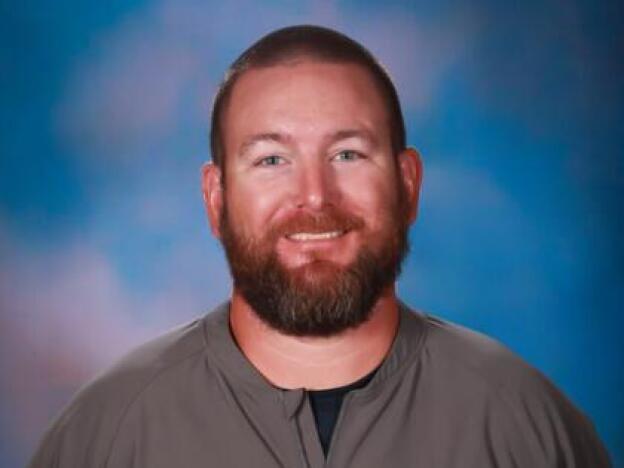  Richard Aspinwall was a popular coach at Apalachee High School, where he also taught math. He is survived by his wife and two young children; Aspinwall is seen here in a photo from the school's website.